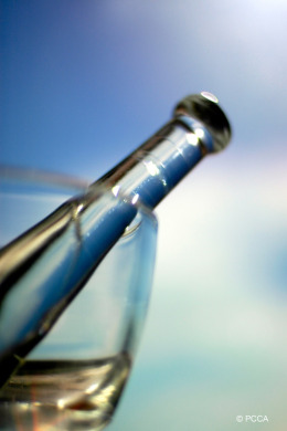 Prescription refills & medication compounding liquid in a clear glass 